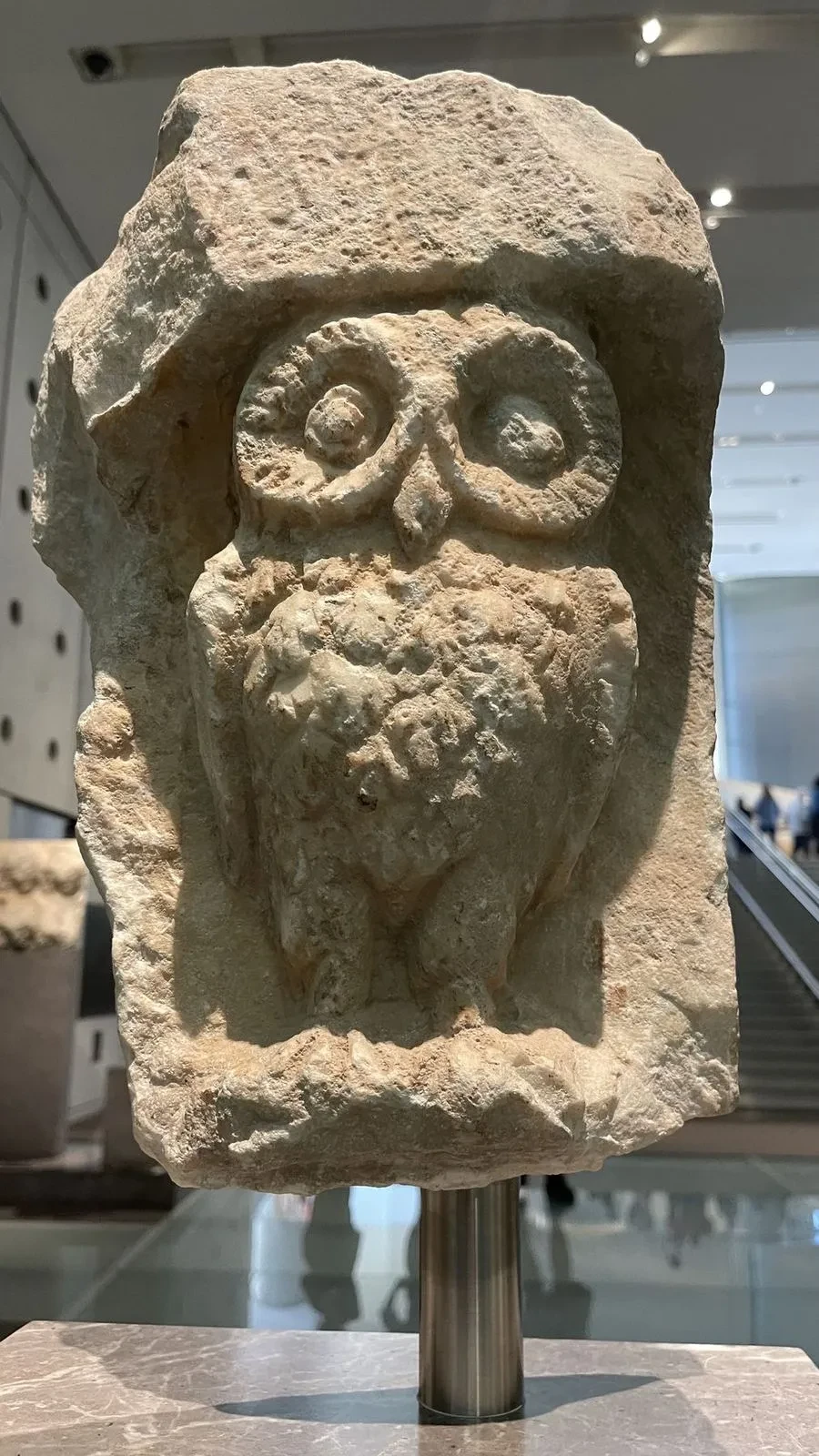 An ancient carved stone owl, the sacred symbol of Athena