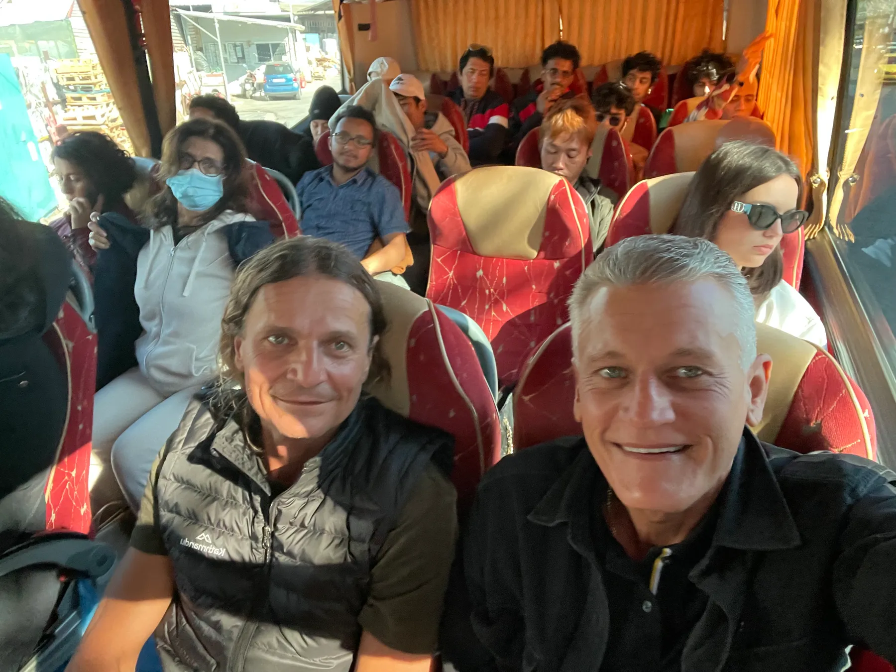 Κωνσταντίνος (Konstantinos) and fellow travellers aboard the crowded coach on the five-hour bus ride to the village