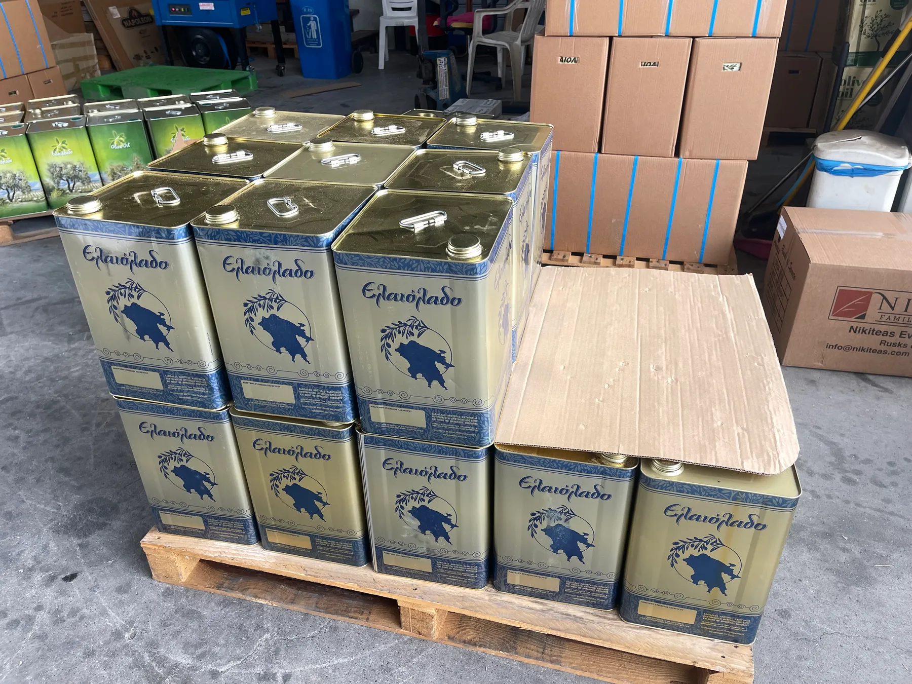 Tins of finished oil stacked on a pallet at the Sparta depot, ready for shipment