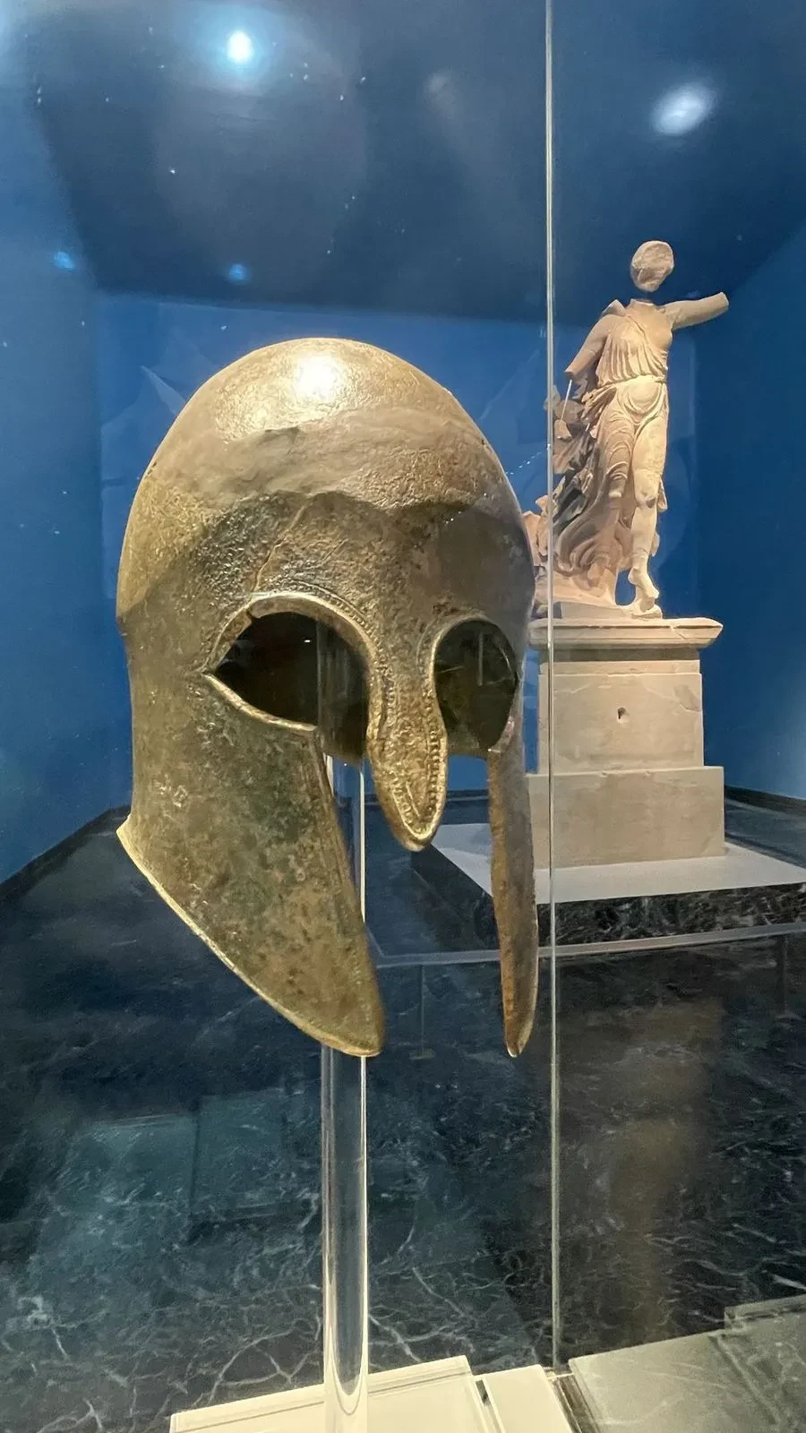 An ancient bronze helmet on display near Olympia