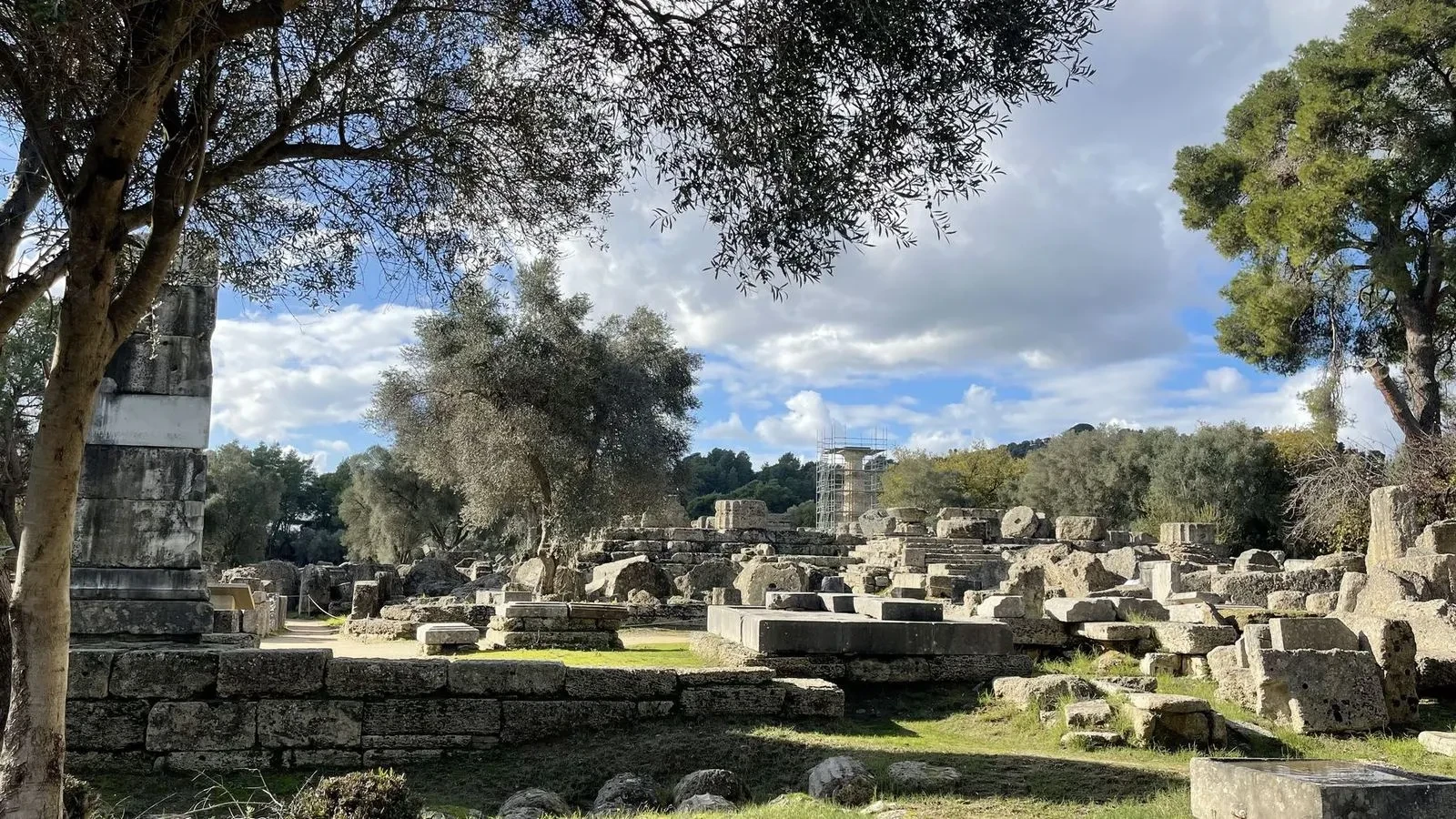 A pathway lined with column ruins at Ancient Olympia