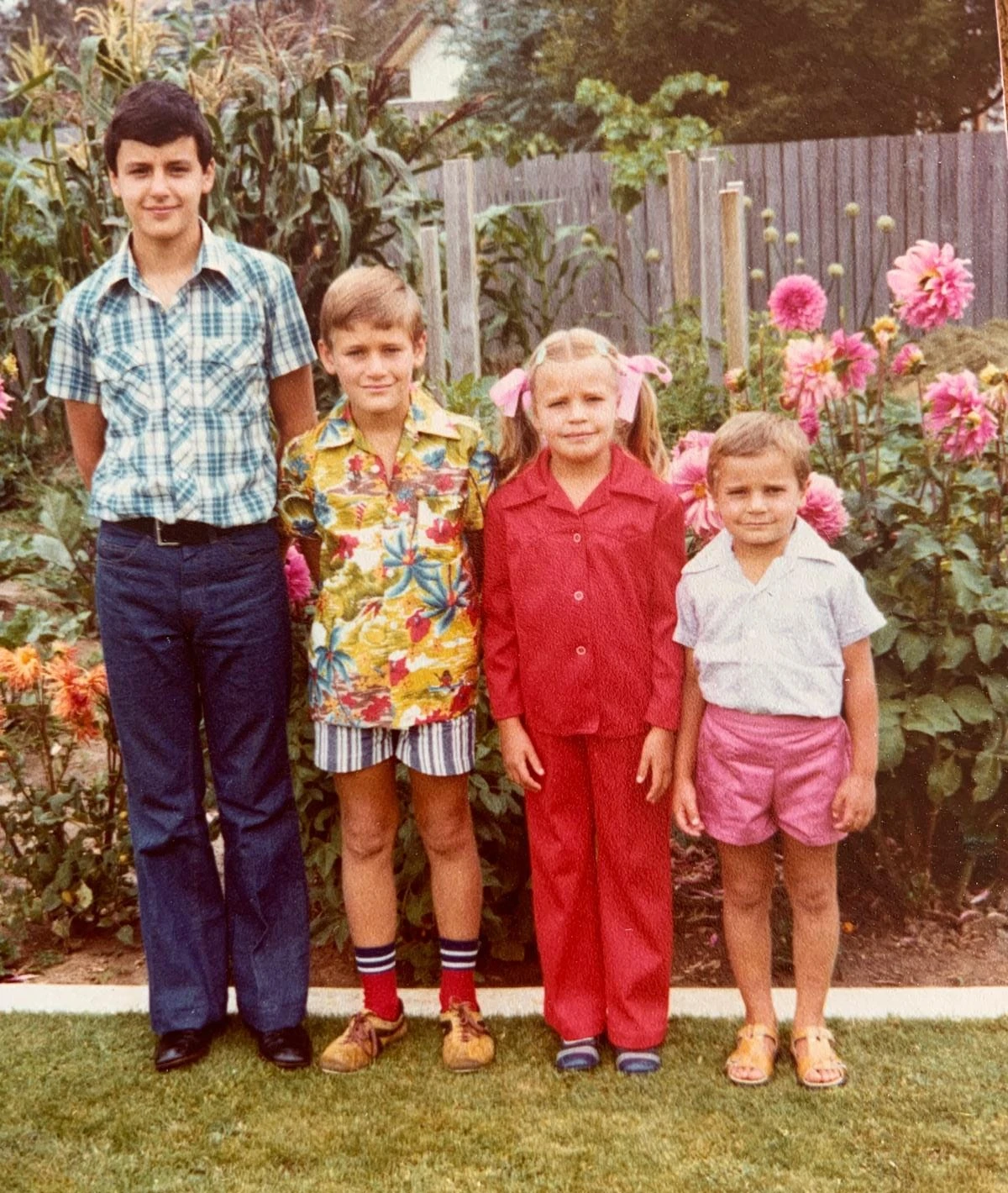 Four children in a garden: cousin Πέτρος (Peter, Melbourne), Κωνσταντίνος (Konstantinos), Ευαγγελία (Evangelia), and Αλέξανδρος (Alexandros)