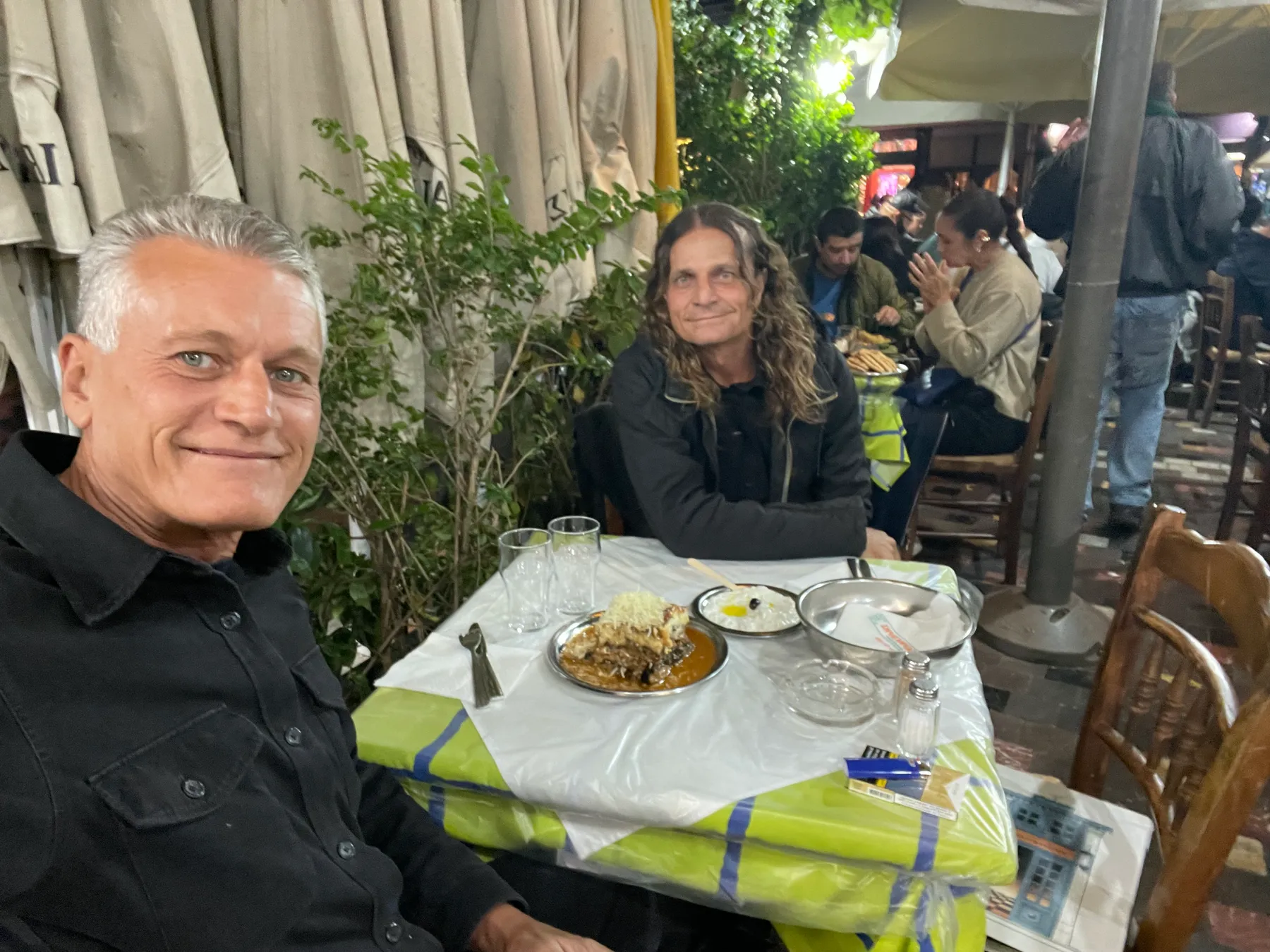 Κωνσταντίνος (Konstantinos) and a travel companion at dinner in Monastiraki, Athens