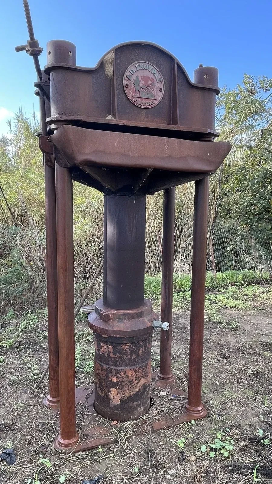 A traditional iron olive press once used on the estate