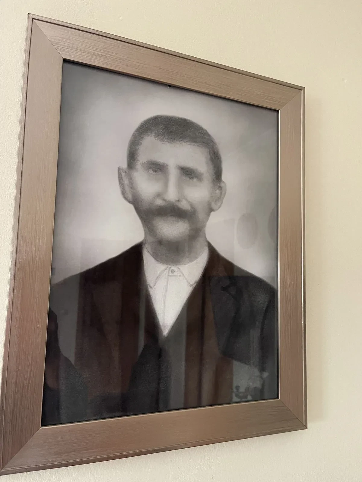 A sepia portrait of the grandfather of Ευάγγελος (Angelo)